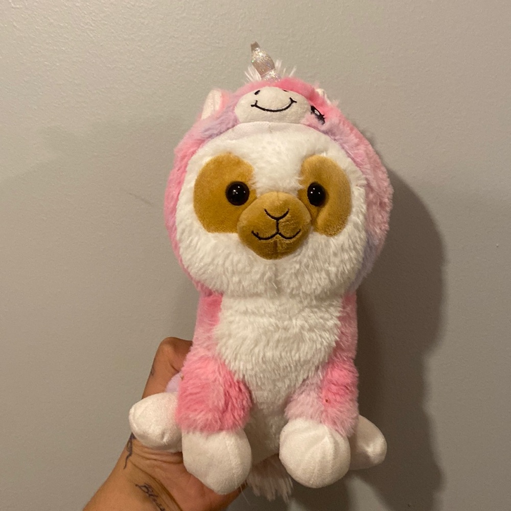 Lama dressed as a unicorn plushie